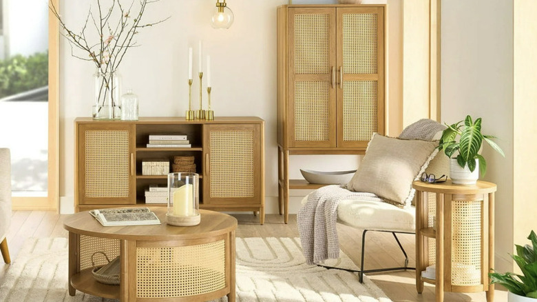 A living room with matching light wood furniture