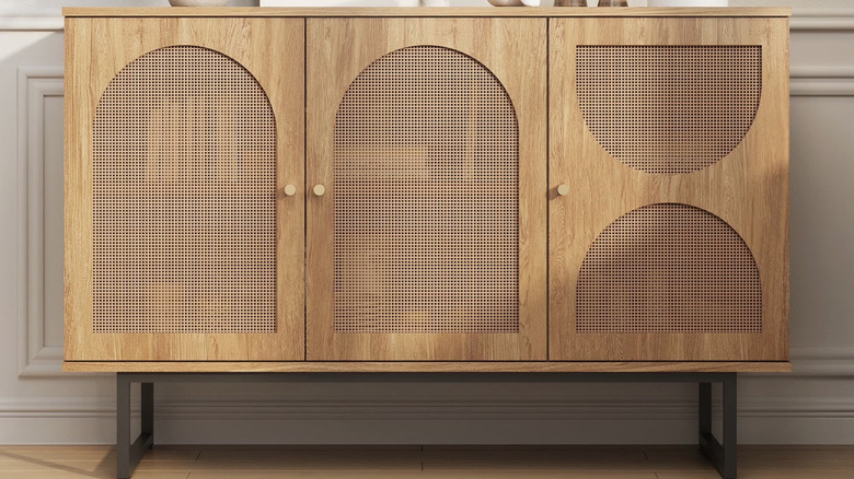 A rattan and light wood storage cabinet