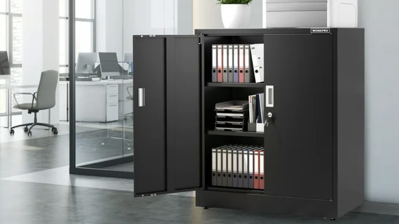 A black metal storage cabinet in an office building
