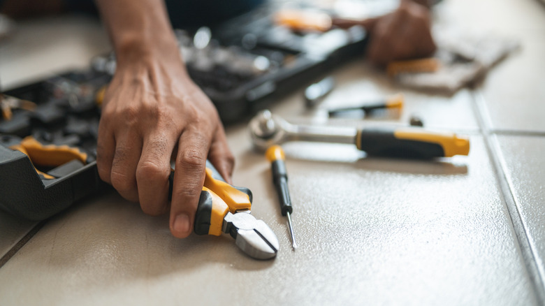 Man with a basic toolkit