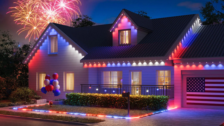 A home is lit up with Govee permanent outdoor lights in a patriotic color scheme