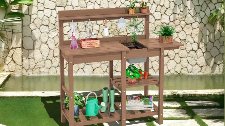A SERWALL potting bench stands in an outdoor patio area