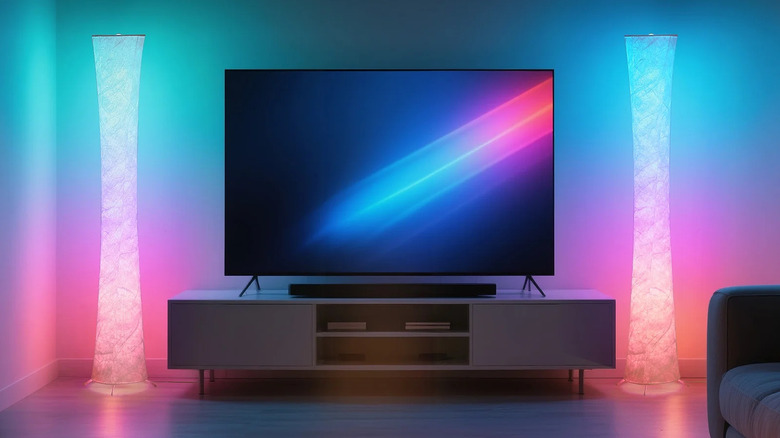 Two color-changing SUNMORY LED Floor Lamps flank a flat screen tv and console