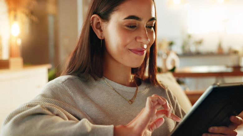 Woman shopping online on a tablet