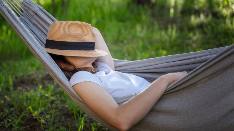 woman sleeping in hammock