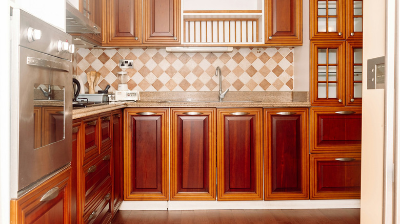 Cherry wood cabinets in kitchen