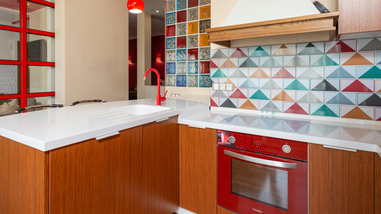 Red oak cabinets in colorful kitchen