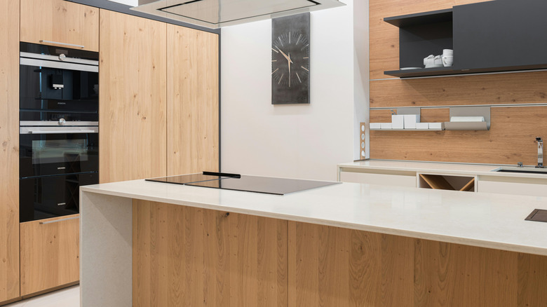 White oak cabinets in a white kitchen