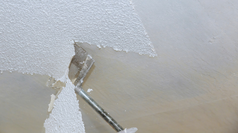 a tool used for scraping texture off a ceiling in use