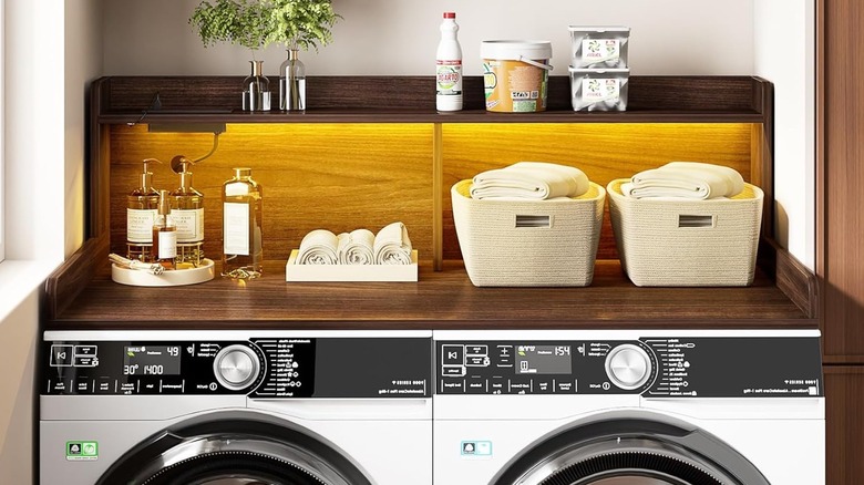 Two-tier washer and dryer countertop with LED lights.