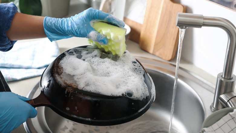 Person washing a pan