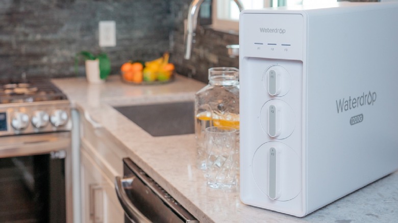 A white Waterdrop Filter filtration system sitting on the counter