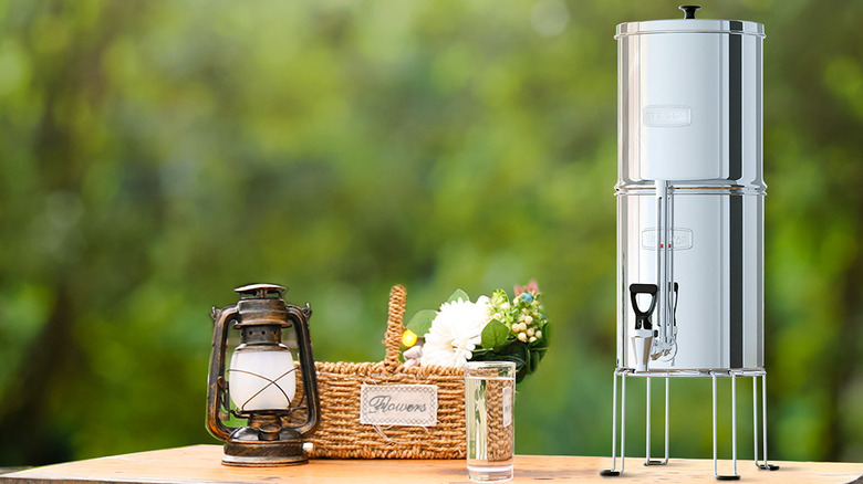 The King Tank gravity-fed water filter system on a table outside