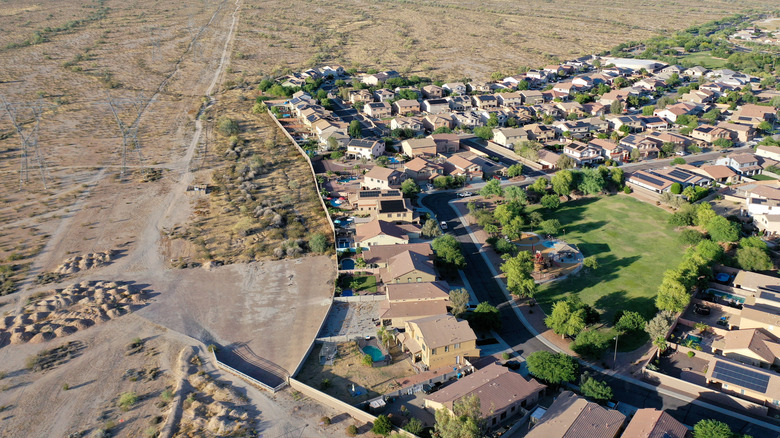 An aerial shot of Buckeye, AZ shows an unnatural green dot of lawns in the desert.