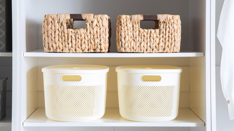Closet with bins on shelves
