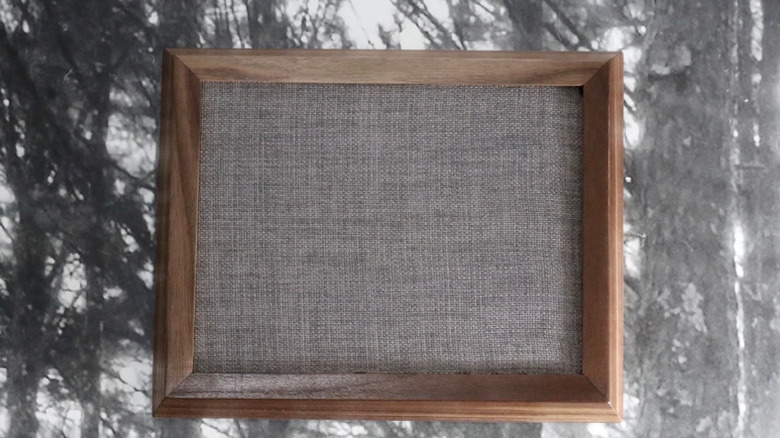 An air vent disguised with a picture frame