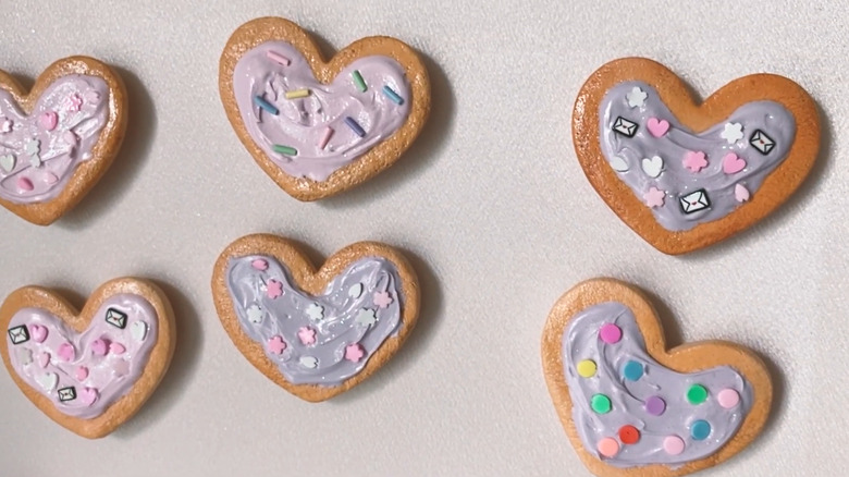 Magnets made of clay that look like heart-shaped cookies made with a cookie cutter