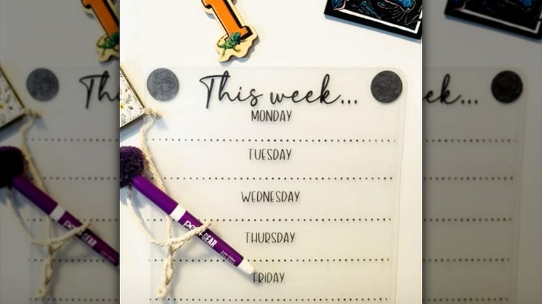 magnetic meal planner on front of white refrigerator