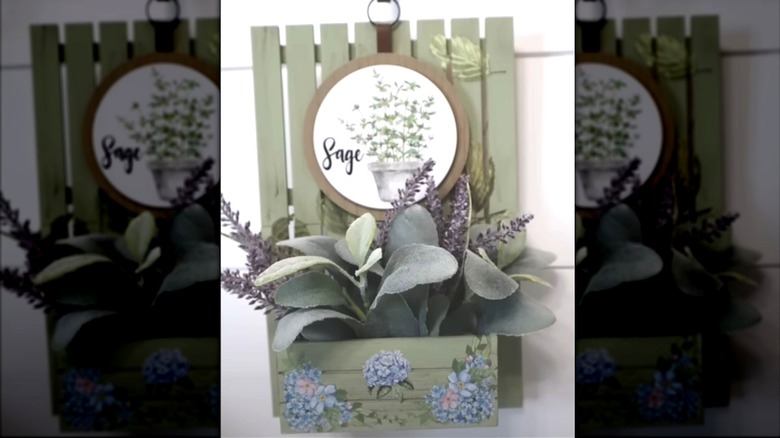 Recipe card holder made of green painted wood with a decorative picture of sage
