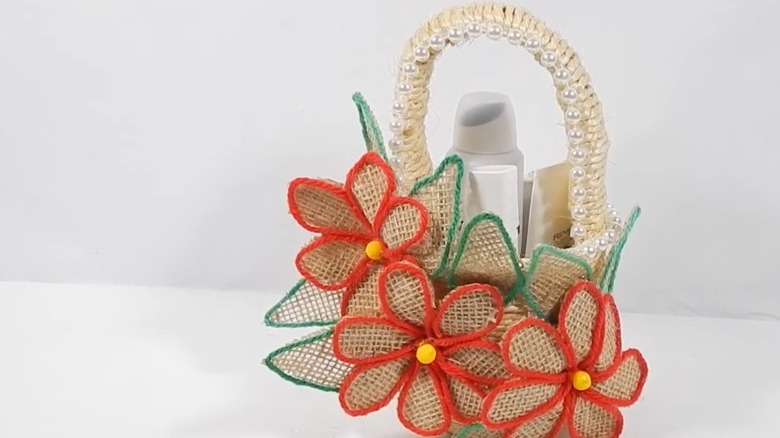 Embellished decorative basket with flowers