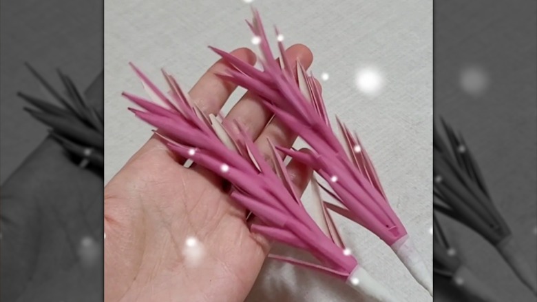 pink artificial flowers made from rubber gloves