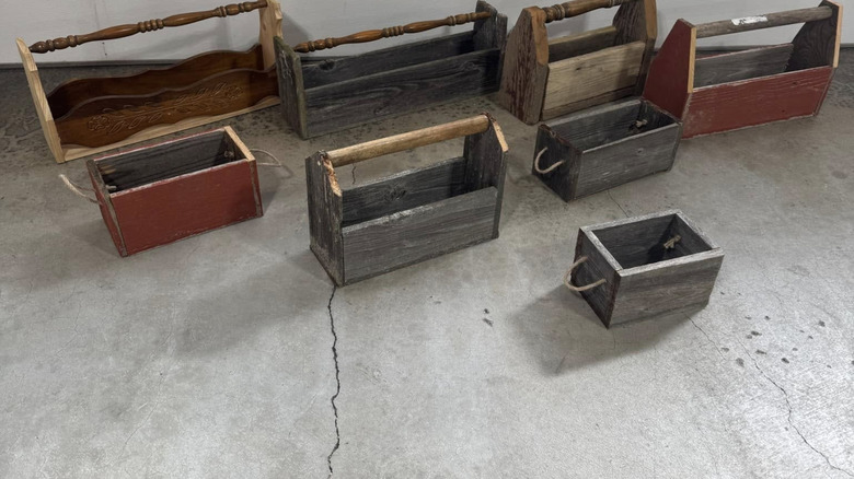 Wooden tool caddies made from scrap wood, furniture legs, and old shovel handles.