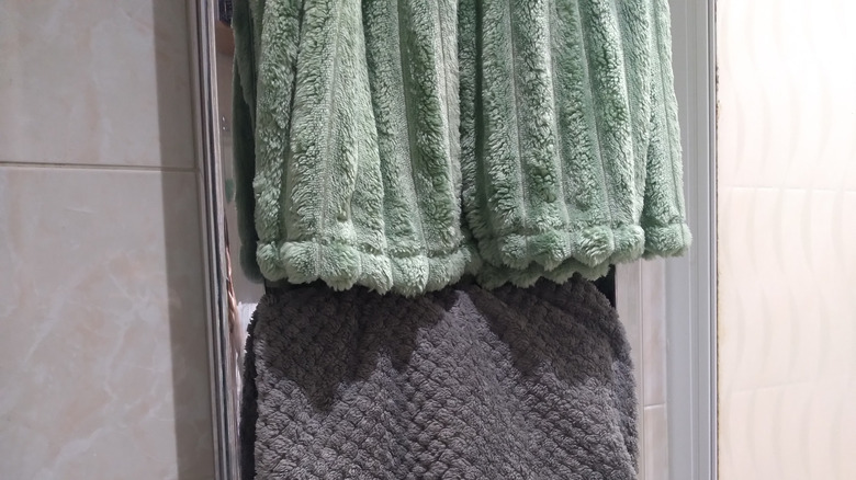 blankets folded on towel rack