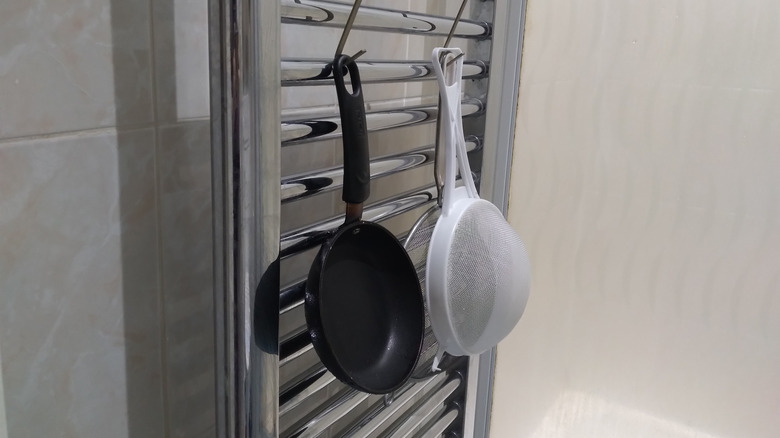 cooking utensils on towel rack