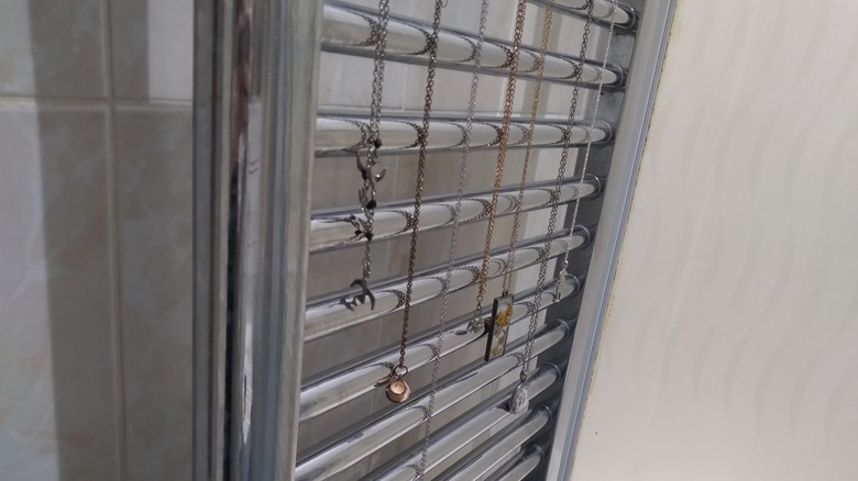 jewelry hanging on towel rack