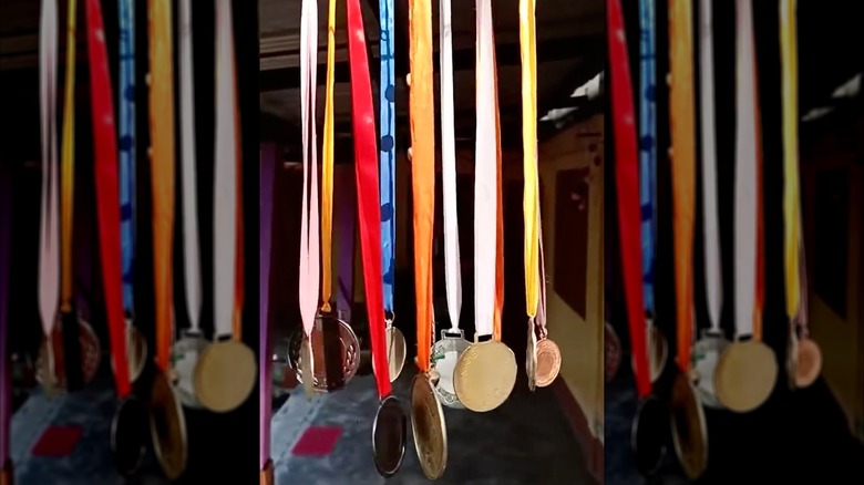 a wind chime made of various colorful medals