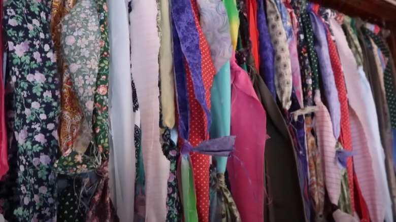 A series of knotted fabric pieces to create a curtain in a doorway.