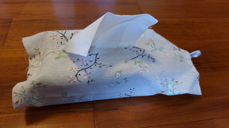 A tissue holder made from a vintage hankie.