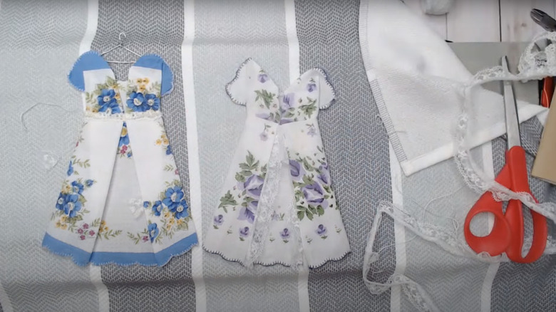 Two pretty dresses for dolls made from vintage hankies.