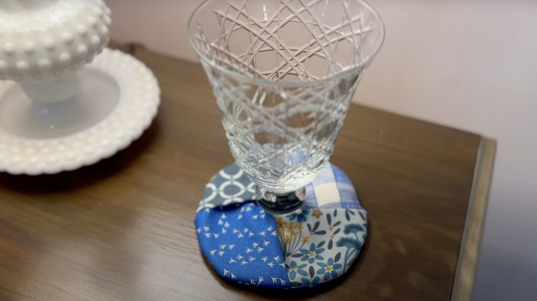 A coaster made from scraps cut from vintage handkerchiefs.