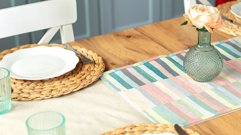 A simple table runner made from vintage handkerchiefs sewn together.