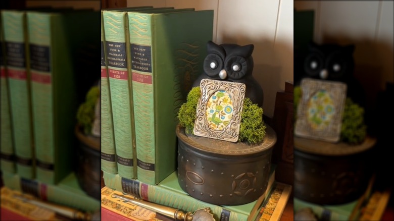 owl statue made into small frame on shelf
