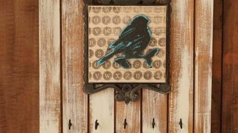 A metal trivet incorporated into a hanging key holder