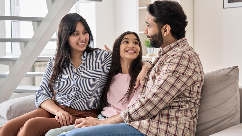 Parents talking to their teen daughter 