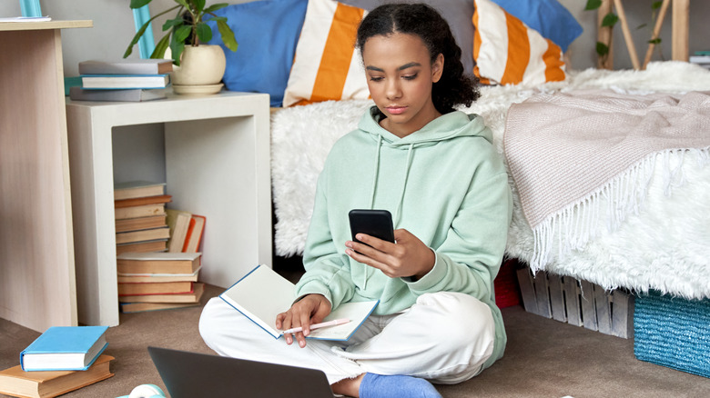 Teen girl checking her phone