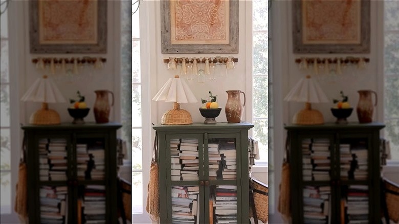 Screenshot of an Instagram video, showing how a boot rack can be turned into a wine glass holder.