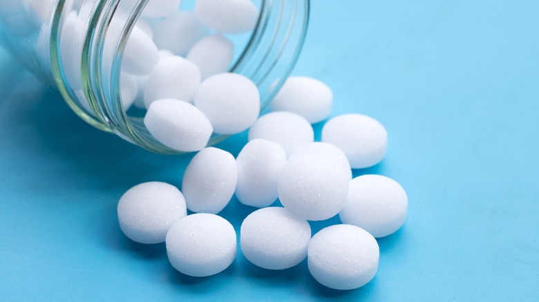 mothballs spilling out of jar