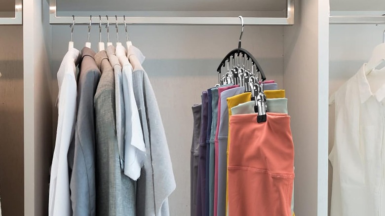 leggings and shirts stored neatly in a closet