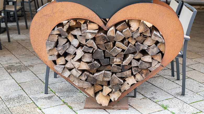 Heart-shaped metal wood rack.