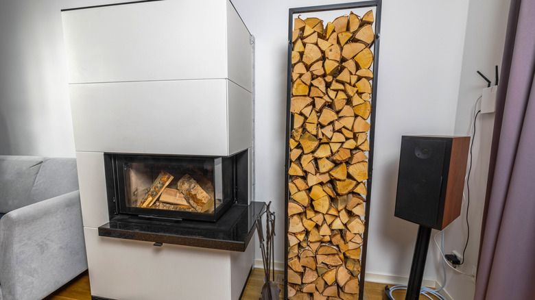 Metal log holder used indoors.