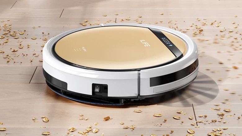 Ilife's gold and white robot vacuum cleaning wood flooring