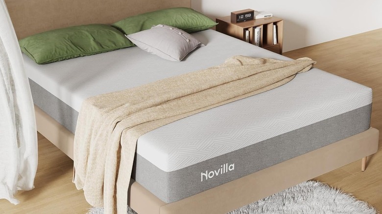 The Novilla 12-inch memory foam mattress on a bedframe in a room with neutral decor