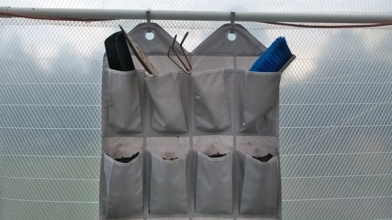 Shoe organizer hung in greenhouse