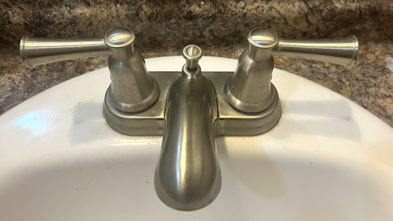 The stainless steel sink after it's been cleaned with cucumber peels.
