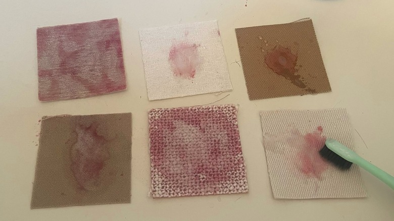 Six wine-stained fabric swatches 