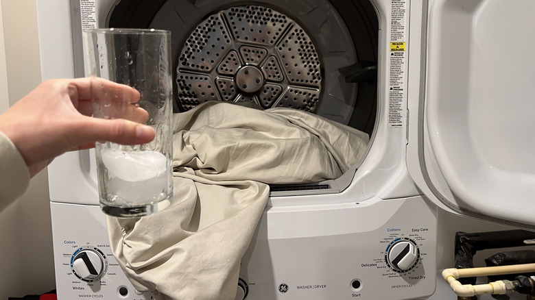 person holding ice before dryer